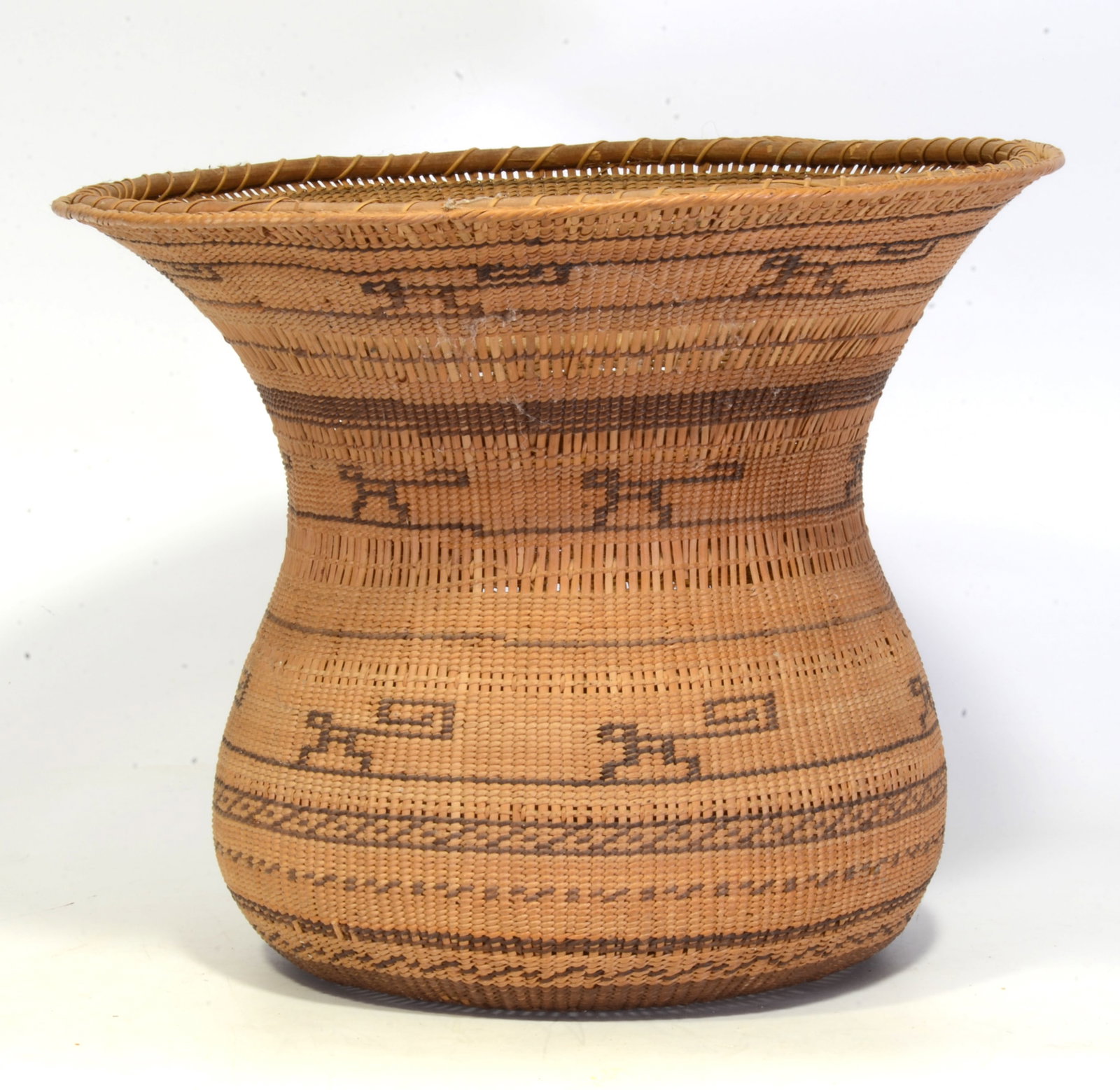 South American Basket: Wekuana Amazonia Cylindrical grass basket with flared rim, Ancestor figures, Height: 8.75" diameter 11". Provenance: from the estate of Harry Wallace, an NYC based antiques dealer and collector who, f