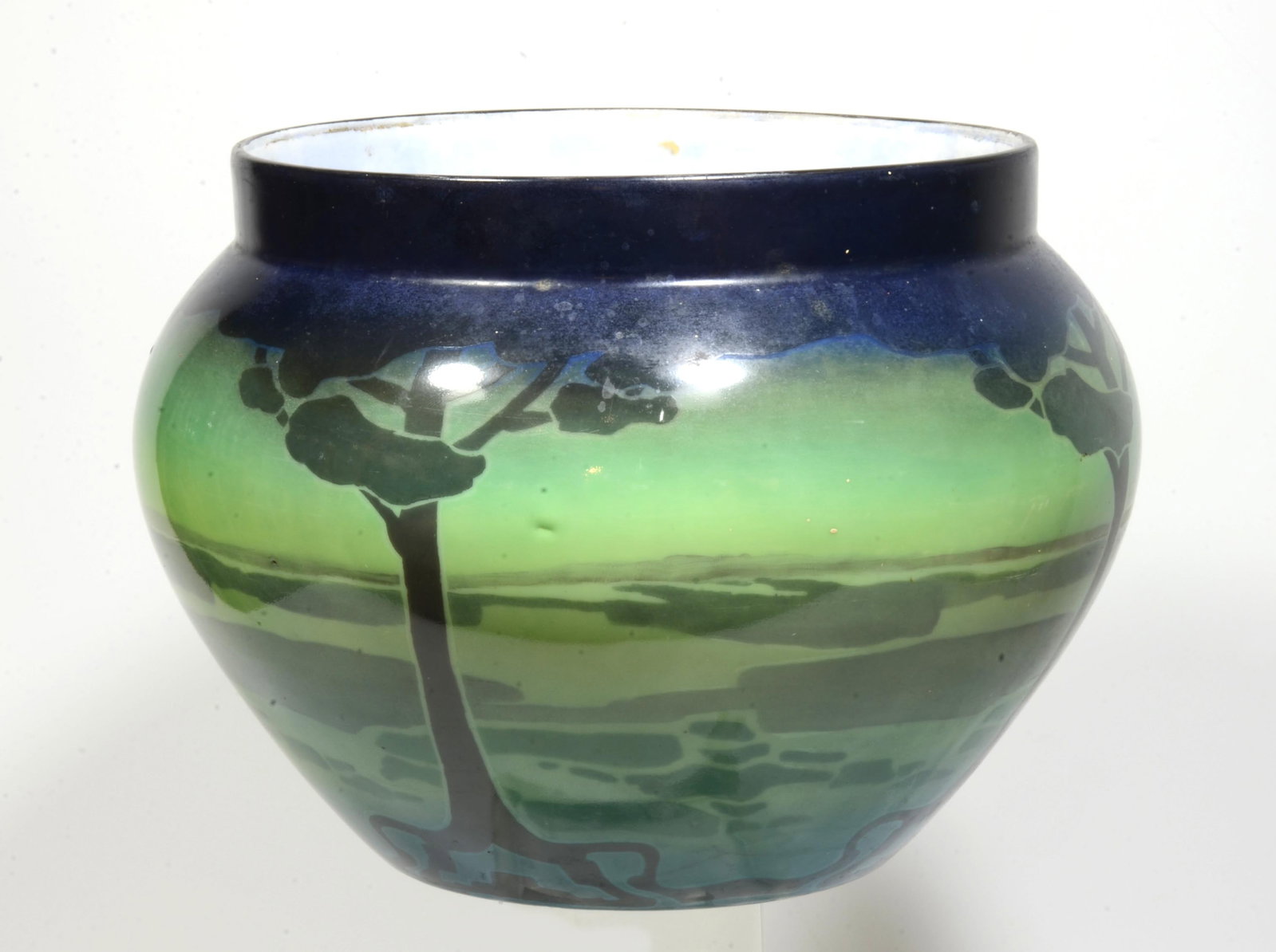 T & V Limoges Art Deco Vase: Blue/Green porcelain whiteware vase with stylized art deco tree pattern. T & V (Tressemanes & Vogt) was a porcelain factory partnered by Gustave Vogt (1849-1937) and Émilien de Tressemanes. Their par