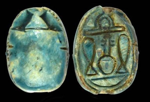 Egyptian Turquoise Glaze Steatite Scarab: Egyptian Turquoise Glaze Steatite Scarab. Ca. 1200 BC, Naturalistic carved blue green glazed steatite beetle; base depicting a central deed-pillar (signifying stability) flanked by a sedge plant (sign