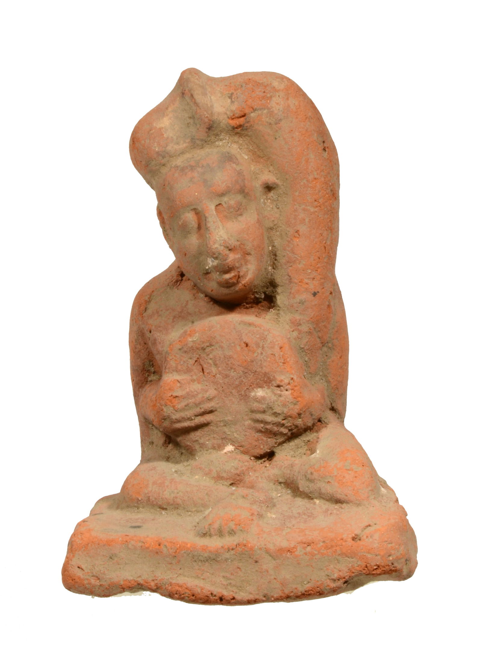Roman-Egypt Pottery Ithyphallic Erotic Seated Figure: Roman-Egypt Pottery Ithyphallic Erotic Seated Figure. Ca 1st Century BC/AD, A solid iron rich pottery Ithyphallic figure, seated with legs bent at the knees, holding a drum in lap with both hands, his