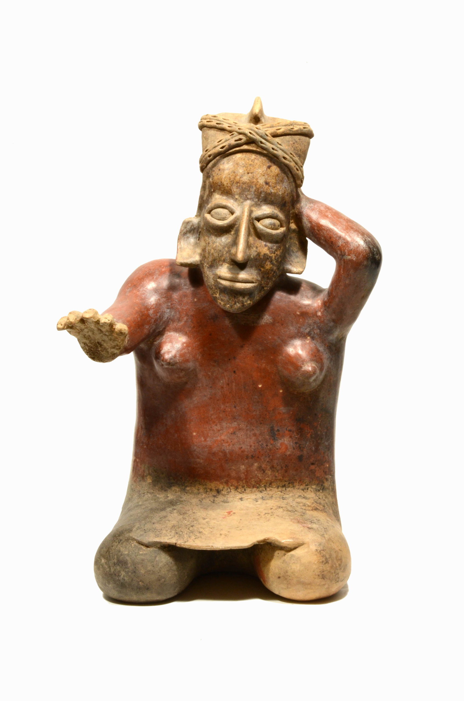 Fine Jalisco Ameca Pottery Seated Female: Fine Jalisco Ameca Pottery Seated Female. West Mexico, Protoclassic, 100 B.C.to A.D. 250 AD. , Abstract effigy figure, seated with one hand out and one hand to head. She has small applied pellets to s
