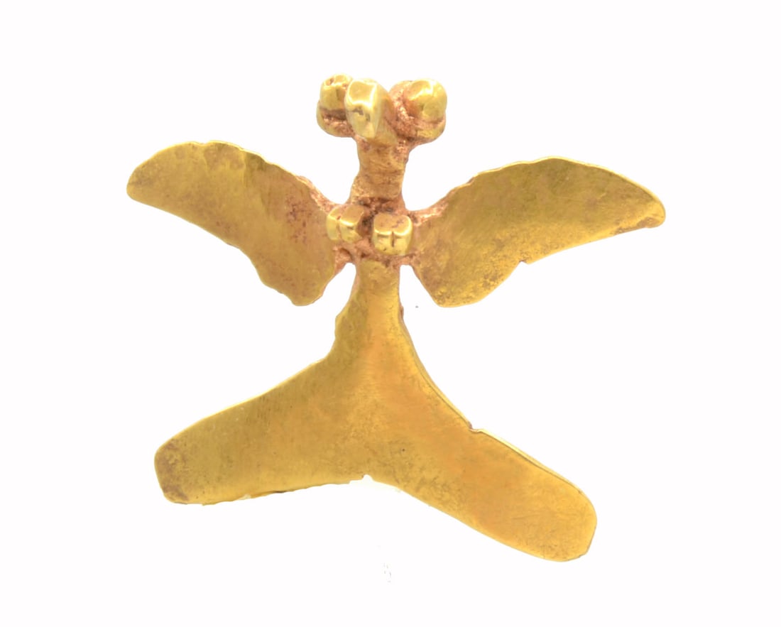 Veraguas Gold Bird Pendant: Veraguas Gold Bird Pendant. Panama Ca. 600 to 800 AD. The raptorial bird cast with bulging eyes, wings and tail fan spread. A loop hole for suspension behind. Size 7/8 inches L; 2.1cm.; 20.2k; weight 