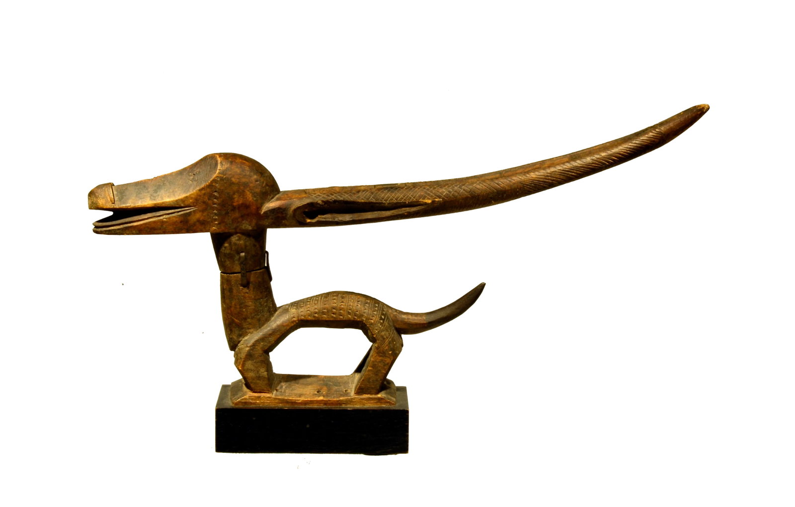 Bamana Chiwara Tji Wara Wood Carved Antelope Headdress: Bamana Chiwara Tji Wara Wood Carved Antelope Headdress . Mali ca. 19th or early 20th century , Of horizontal form, the four legs pierced transversely for attachment, the pointed abdomen beneath the ba