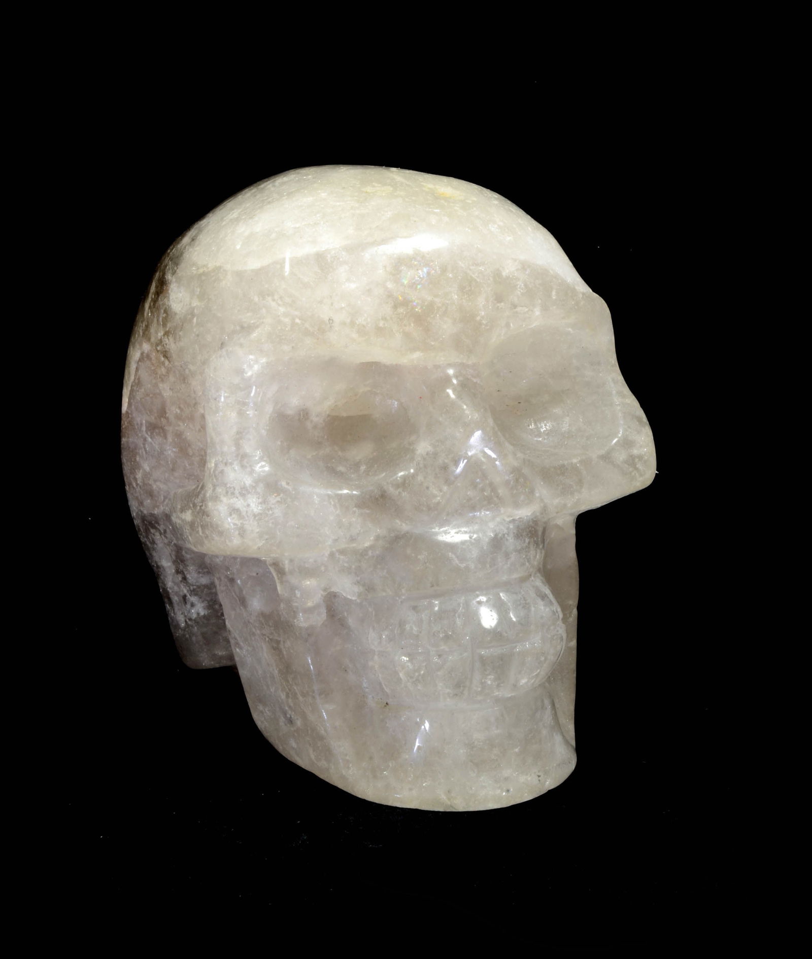 Tibetan Crystal Skull: Tibetan Crystal Skull. , This is a handsome translucent quartz stone with large deep socket eyes, teeth and cranial joins.Size 4-3/8 in L. Provenance:Ex John F. Casey, Riverdale, New York, (1944-2023)