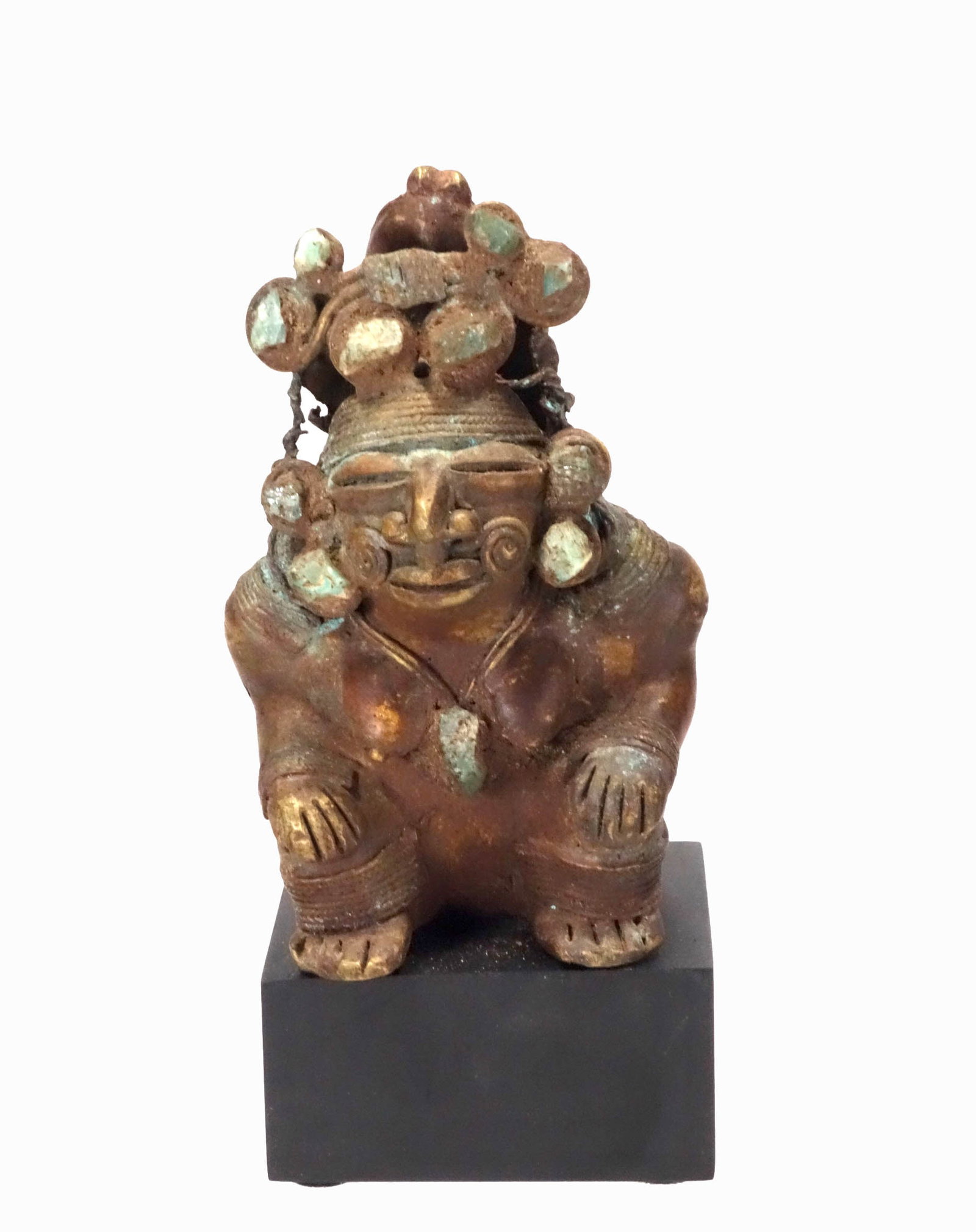 Calima Gilt Bronze Tumbaga Seated Cacique: Calima Gilt Bronze Tumbaga Seated Cacique. Colombia, Cast with appliqu?s or inlays and filigree wire work and into the form of a seated figure with hands on knees and complicated headdress. Size 4-1/2