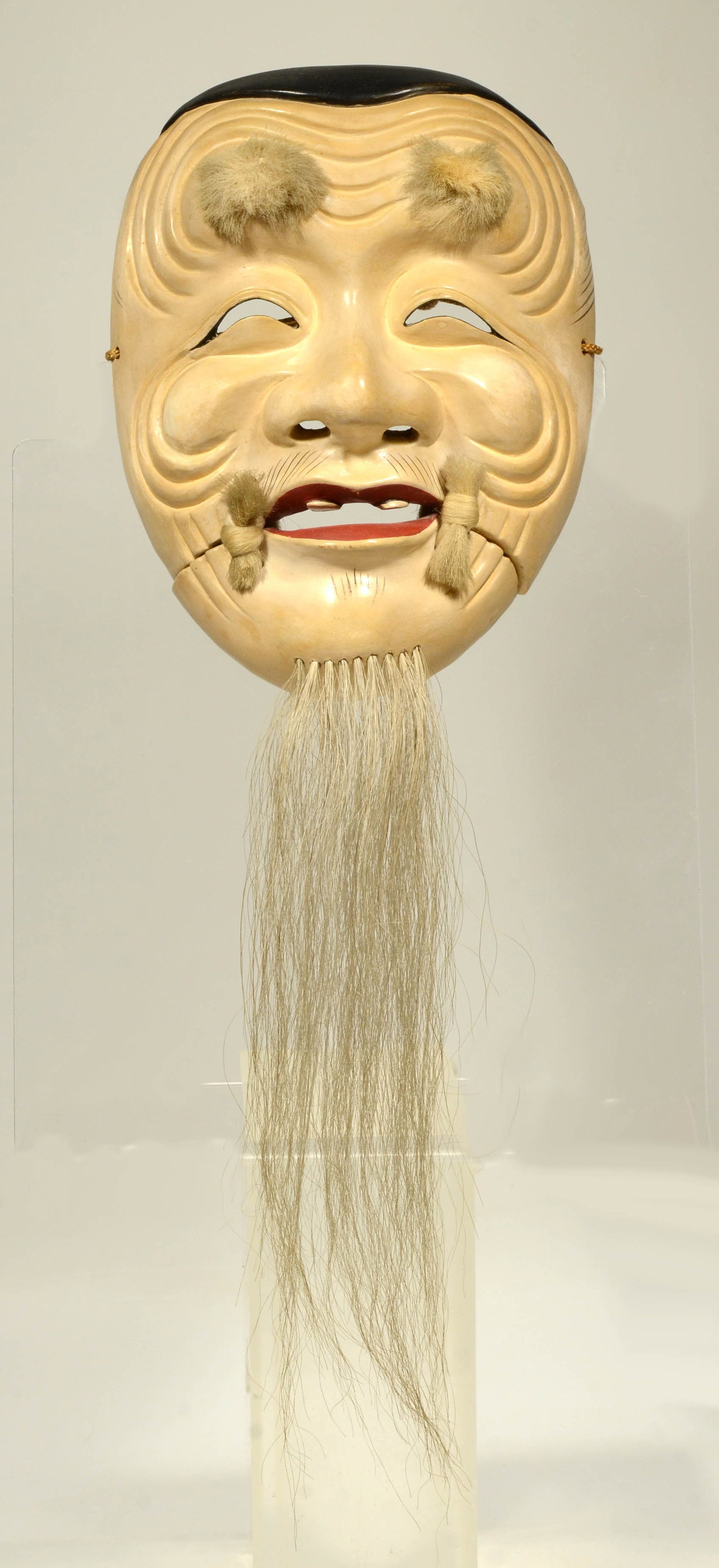 Japanese lacquer Noh Theater Mask: Wood, gesso, lacquer pigments and animal hair. Japan, Edo Style, polychrome pigments and gesso over wood, beard applied animal hair, free moving lower jaw attached with silk cords. The white-faced mas