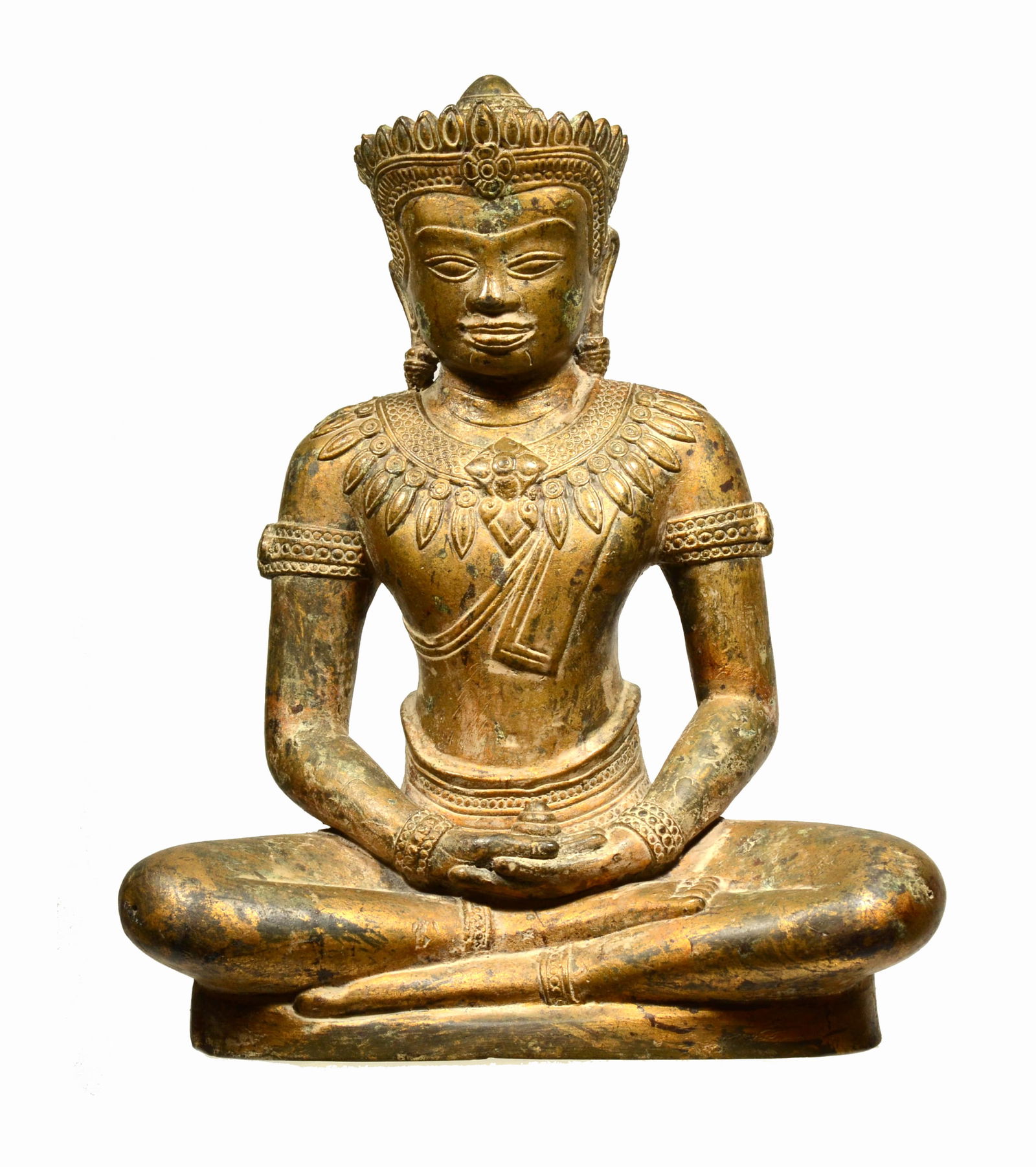 Khmer Gilt Bronze Seated Buddha: 20th century AD The Buddha wears ornate brocade pattern drapery and the surfacet. His face with a serene facial expression,crown, long ear lobes, thin aquiline nose and fleshy outlined lips. Size 10 i