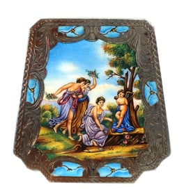 An antique Austrian silver and enamel compact depicting "Cupid Bound by the Graces"