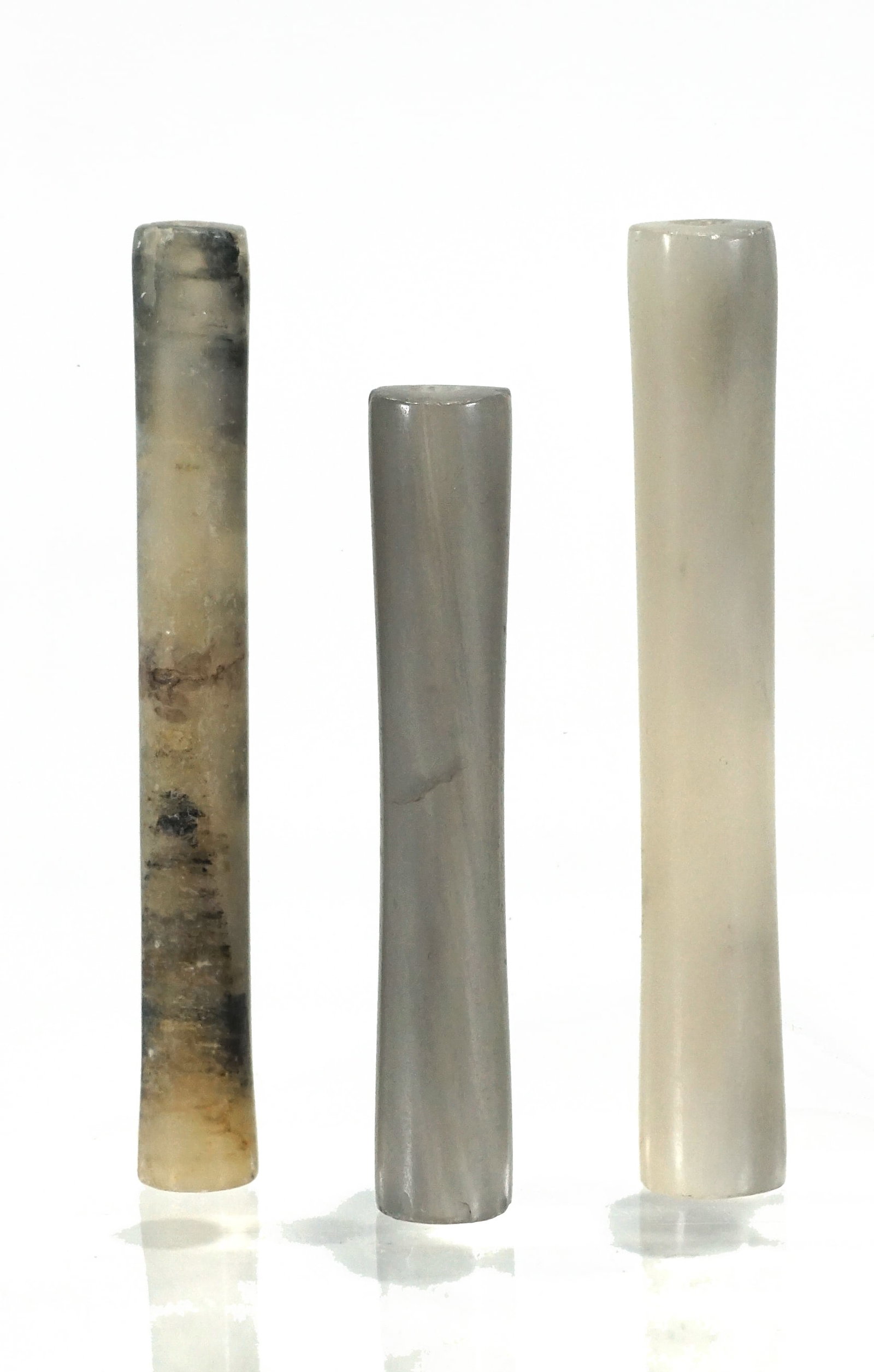 Three Ancient Pre-Columbian Tairona Tubular Stone Beads Circa 800 – 1600 CE: Three Ancient Tairona Tubular Stone Beads Circa 800 – 1600 CEA group of three finely carved tubular stone beads from the Tairona culture, a prominent pre-Columbian civilization of northern Colombia.