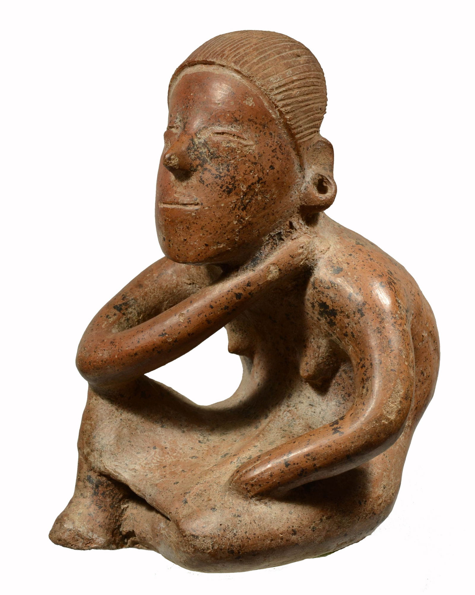 Pre-Columbian Fine Colima Comala Pottery Seated Female: West Mexico, Protoclassic, ca. 100 B.C. - A.D. 250. Seated woman with nude chest and wearing a skirt and ear pierced with holes for adornment. A pleasing faial expression with almost closed eyes. Hair