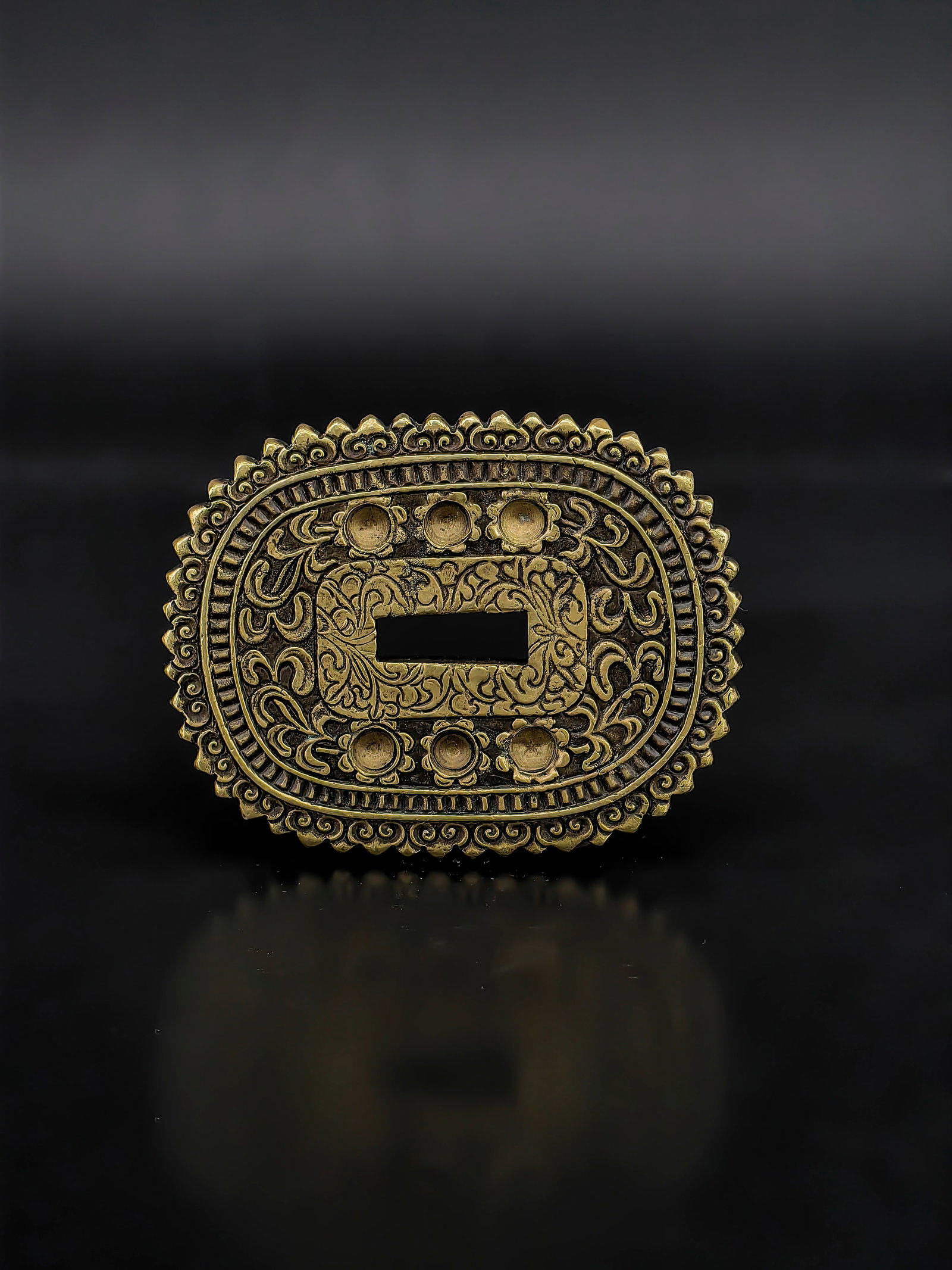A Japanese Edo Period Bronze Tsuba: A bronze oval tsuba with flamed rim, featuring bold high-relief karakusa (arabesque) scrollwork on both sides. The flowing, vigorous carving exhibits exceptional metalwork skill. Warm patina and