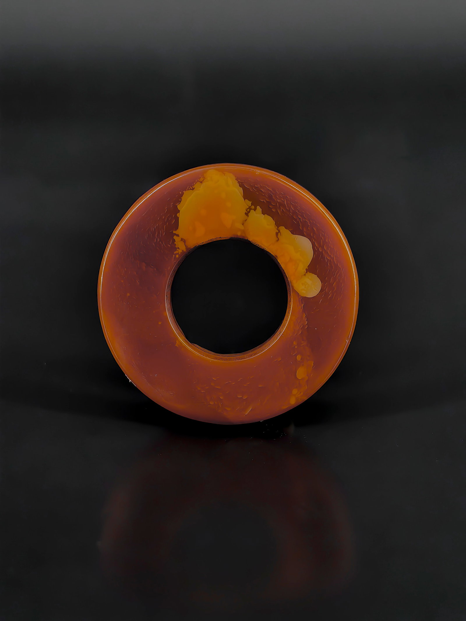 An Antique Agate Ring: A red agate Ping'an Kou (smooth ring pendant) dating back to the Republic of China period. The piece exhibits a rich, deep reddish-brown coloration with a warm, seasoned patina. Its surface showcases