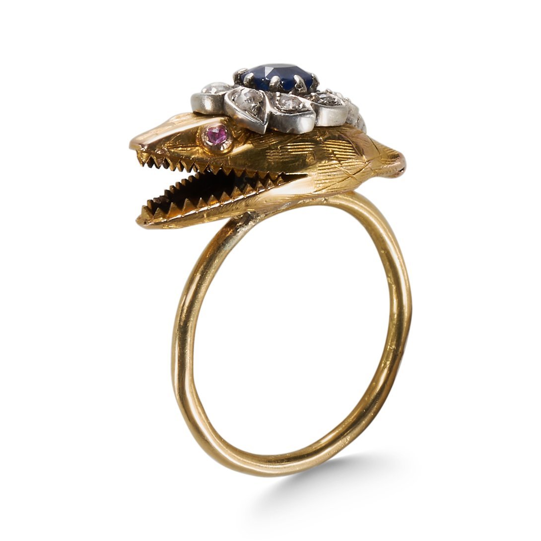 A SNAKE HEAD RING, SET WITH SAPPHIRE, RUBIES AND ROSE CUT DIAMONDS. (1 of 3)