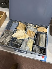 Misc gun parts in metal case