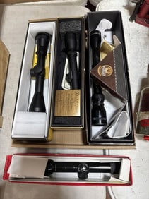 4 rifle scopes in boxes