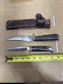 2 hunting knives one has scabbard
