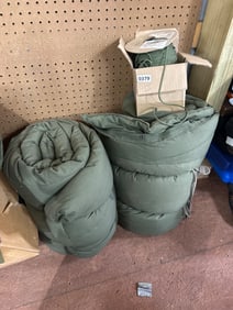Two Green Sleeping Bags and Spool