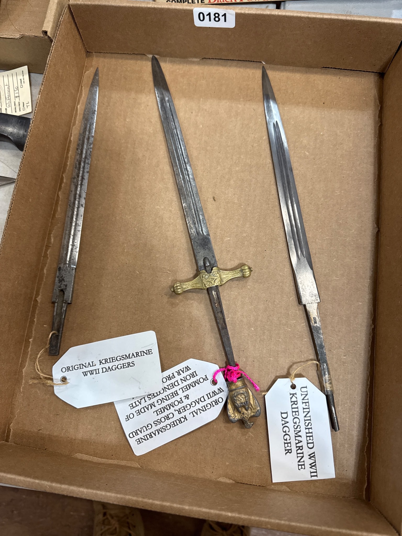 Three Kriegsmarine WWII Dagger Blades: Three Kriegsmarine dagger blades from WWII, including one with a cross guard and pommel, noted as iron indicative of late-war production. All items are sold AS IS, WHERE IS with no warranties or guara