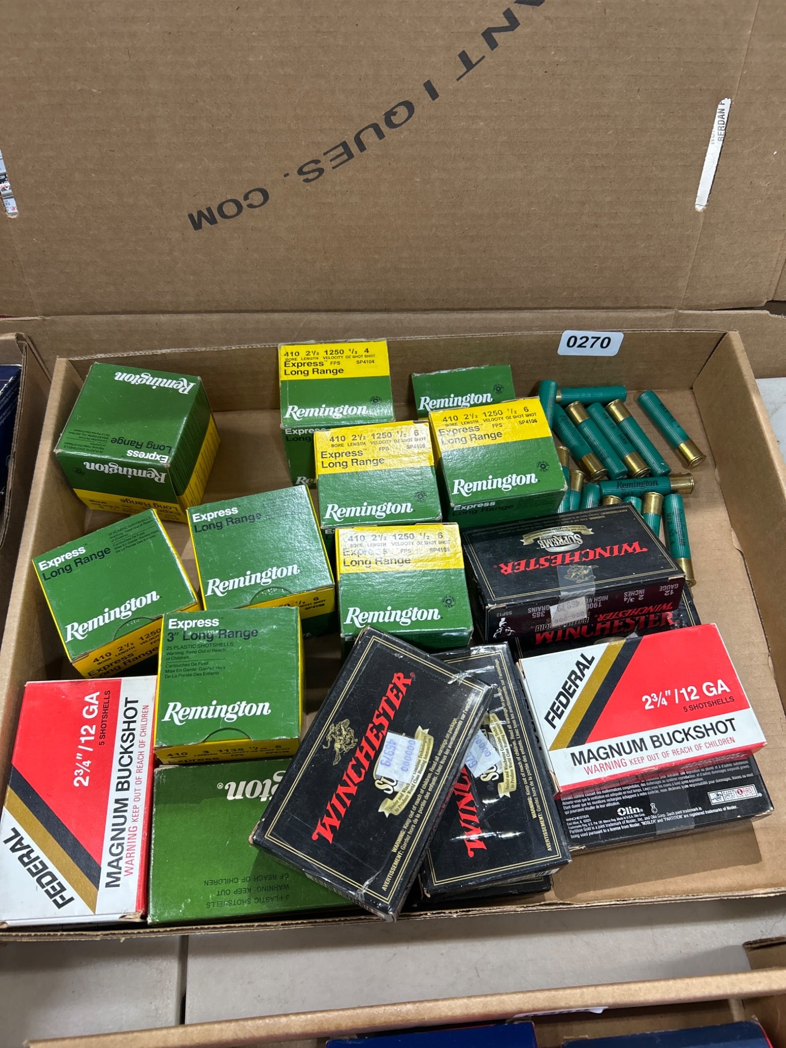 Boxes of Shotgun Shells: Boxes of shotgun shells from brands like Winchester, Remington, and Federal. Includes various gauges, lengths, and shot types. All items are sold AS IS, WHERE IS with no warranties or guarantees of an