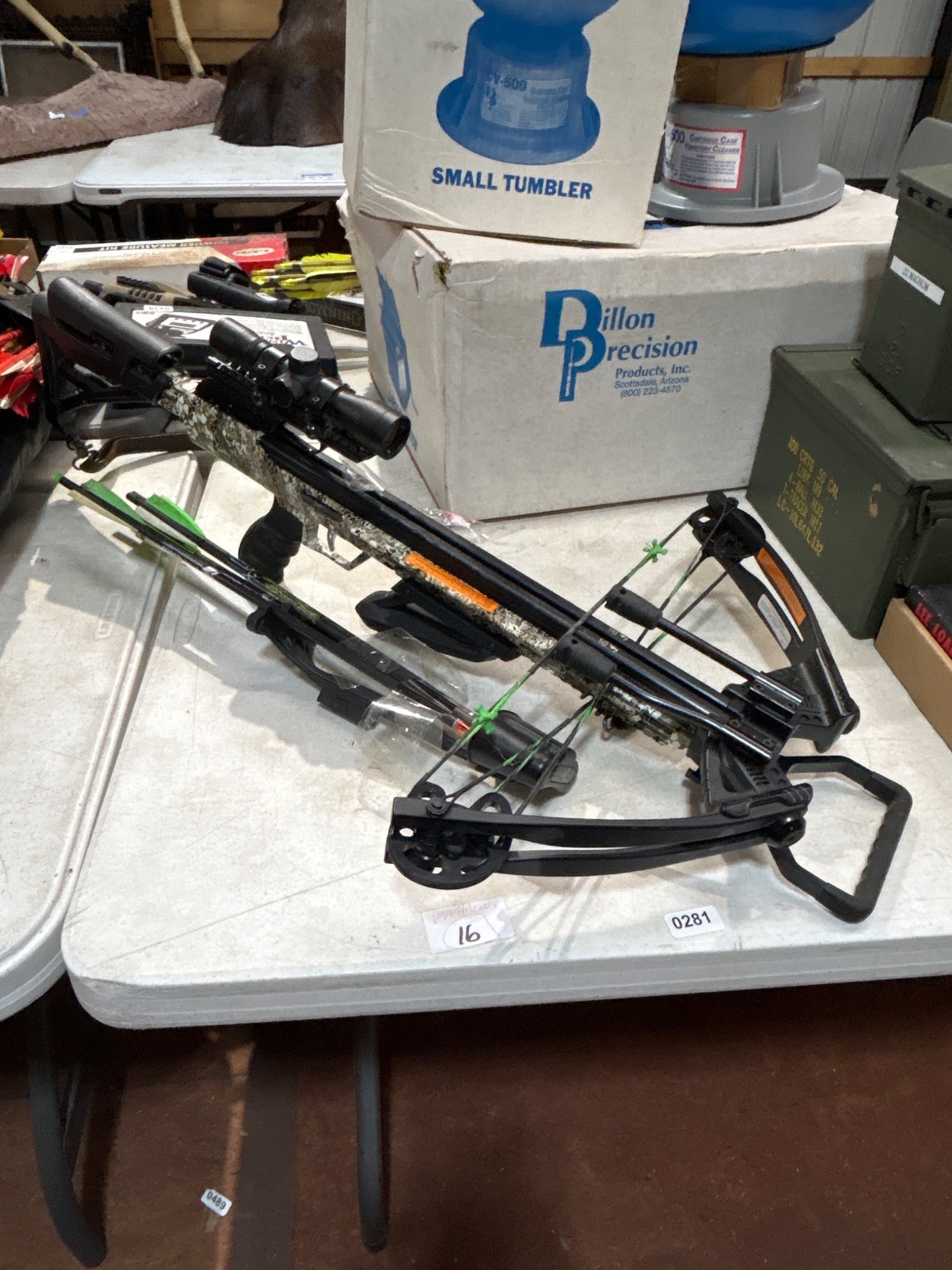 Carbon Express PileDriver Crossbow Set: Carbon Express PileDriver crossbow featuring camo finish, scope, and quiver with arrows. Includes broadheads. Condition and functionality unknown. All items are sold AS IS, WHERE IS with no warranties