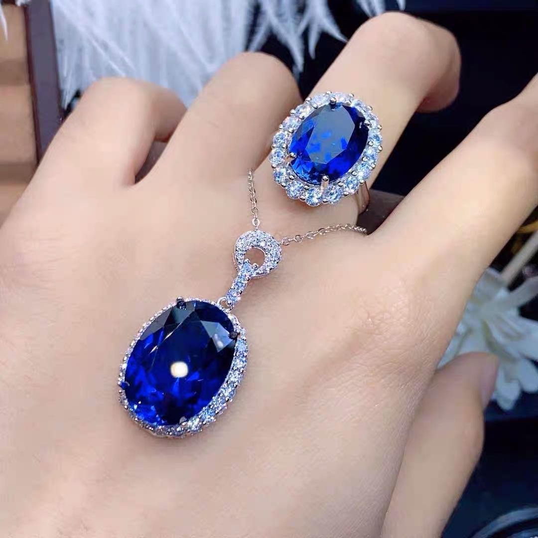 925 Silver Tanzanite Pendant and Ring Two-Piece Set: 925 Silver Tanzanite Pendant and Ring Two-Piece Set ****** Metal: 925 Silver / Main Stone: Tanzanite / Color: Blue / Pendant Main Stone Size: 12*16mm / Ring Main Stone Size: 10*14mm