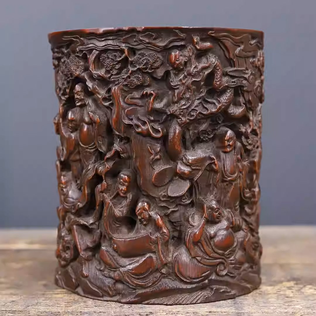Bamboo carved pen holder depicting the Eighteen Arhats: Dimensions: Length 13.5cm, Height 15cm Weight: 355g