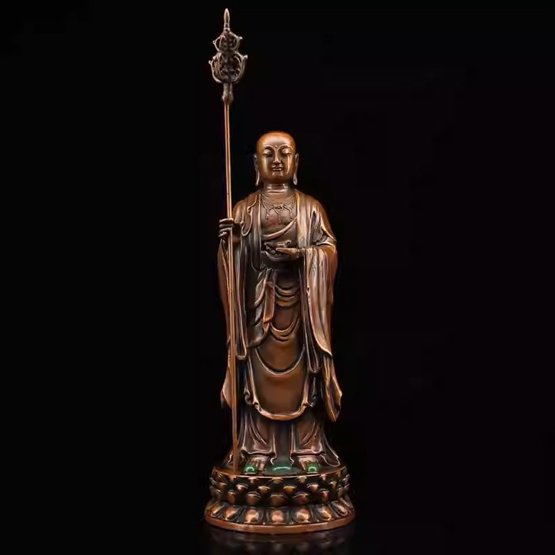 An antique bronze statue of Ksitigarbha Bodhisattva inlaid with gemstones: Dimensions: Width 8cm, Height 24cm Weight: 1184g