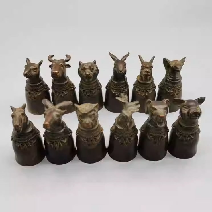 A set of twelve bronze wine cups depicting the twelve zodiac animals: Diameter: 3 cm, Height 6cm, Weight: 964 grams
