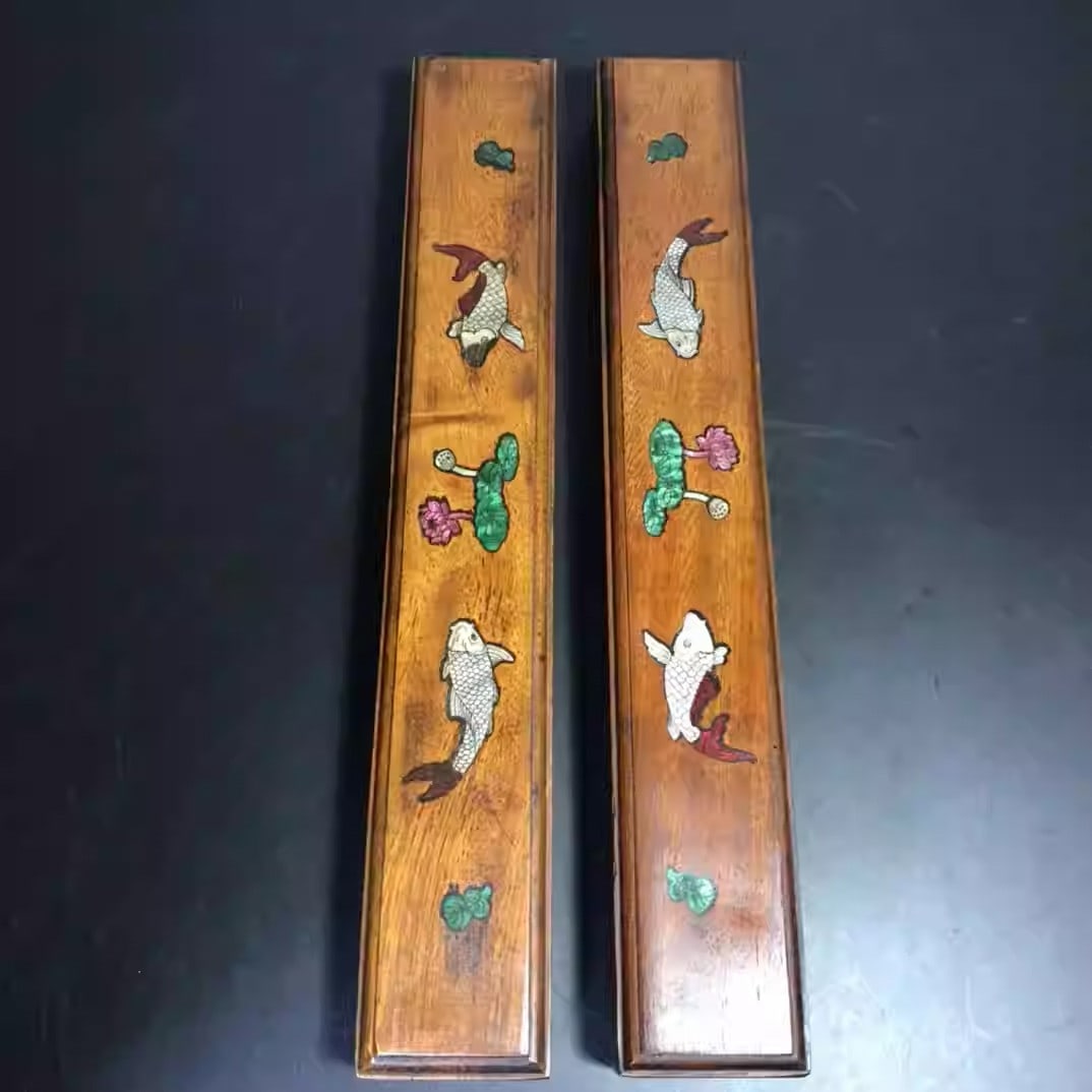 Rosewood ruler inlaid with mother-of-pearl depicting a motif of abundance year after year: Each piece is 32 centimeters long, 5 centimeters wide, and 3.5 centimeters thick.