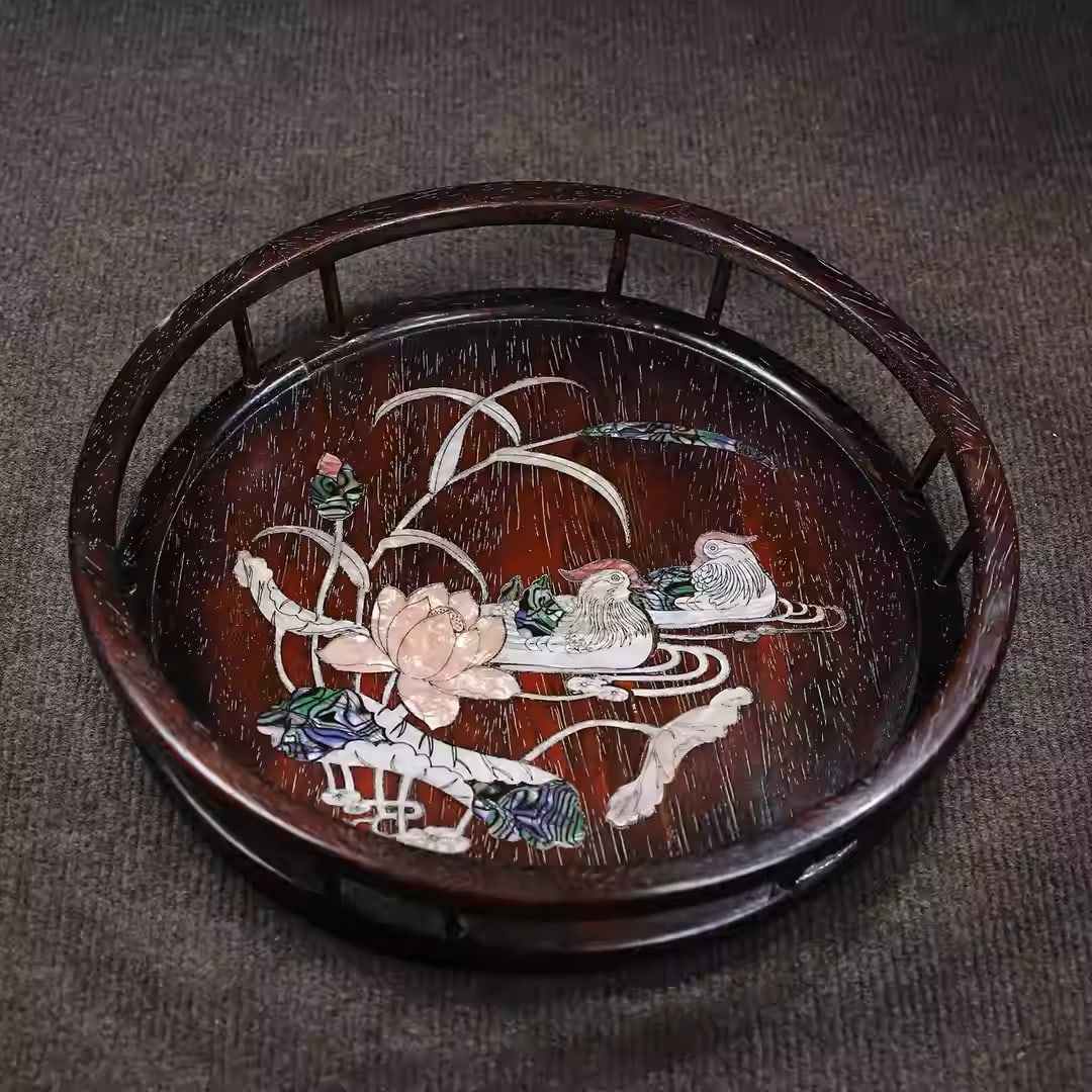 A round sandalwood tea tray inlaid with mother-of-pearl depicting mandarin ducks playing in water: Dimensions: Length 32cm, Width 32cm, Height 7cm
