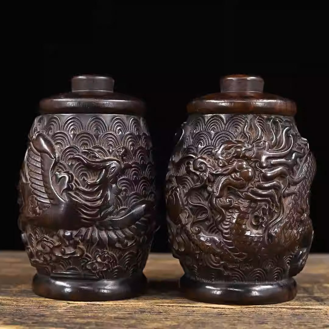 A pair of sandalwood tea caddies with carved dragon and phoenix motifs: Dimensions: Width 12cm, Height 16cm Total Weight: 948g