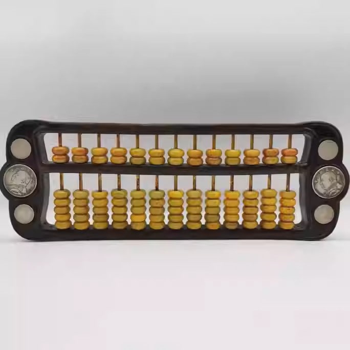 A black ebony abacus with beads made of Hetian jade and inlaid with Yuan Shikai silver dollars: Dimensions: Length 41.5cm, Width 14cm, Weight: 1407g