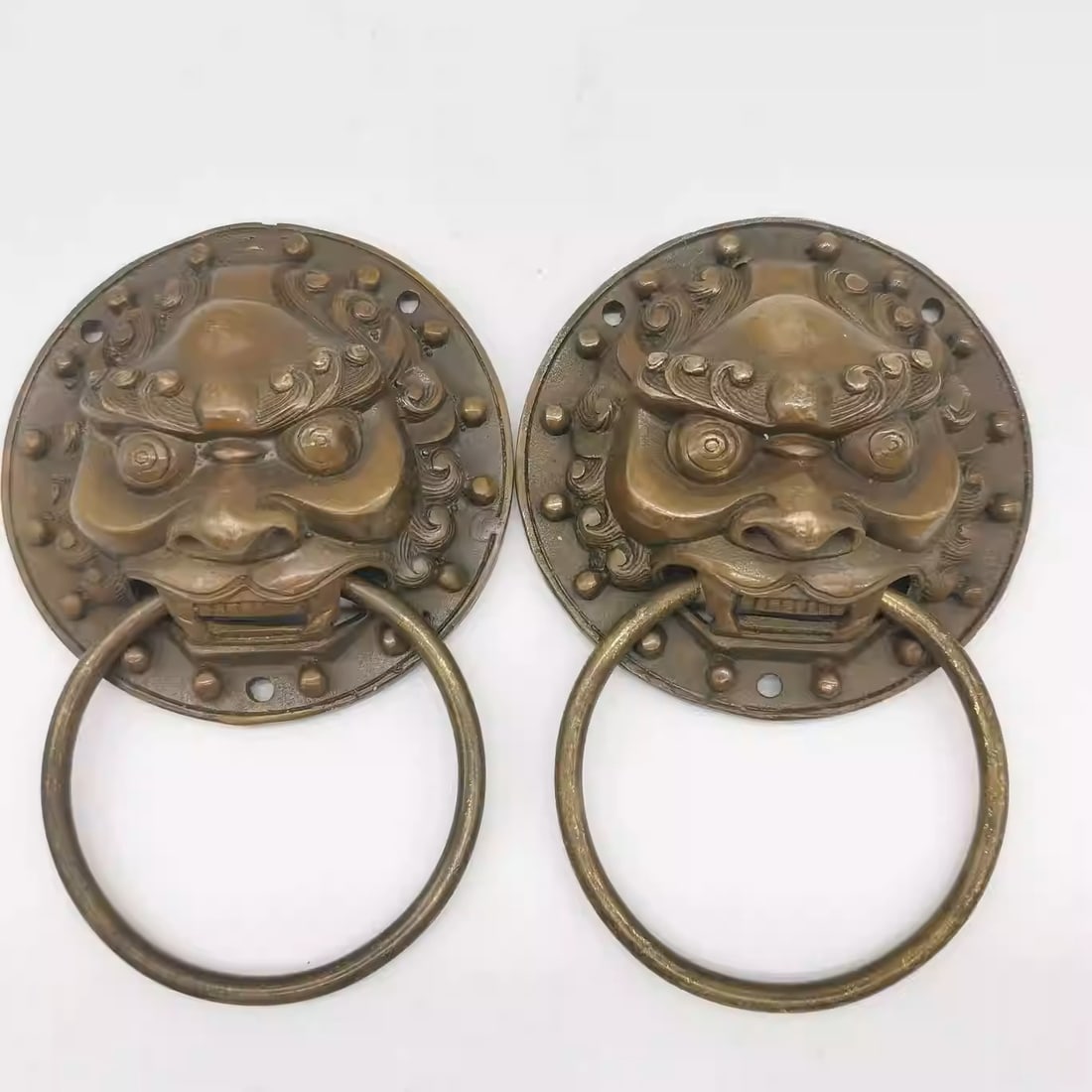A pair of brass lion door knockers (1 of 5)