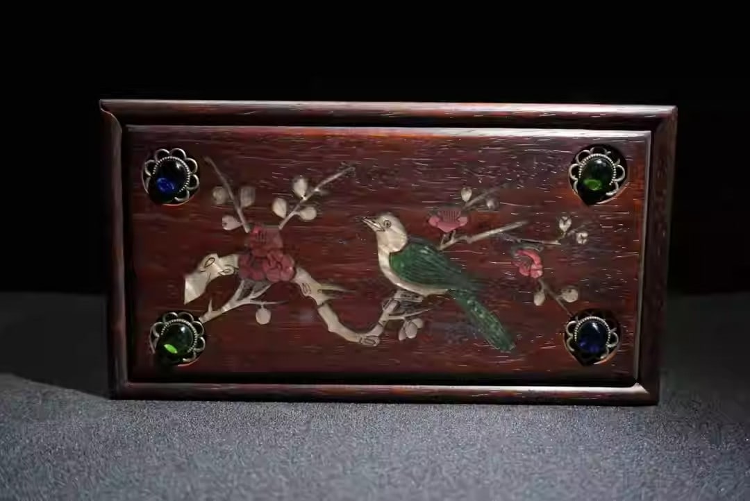 Rosewood jewelry box inlaid with mother-of-pearl depicting a scene of joyful celebration: Length 22 cm, width 12 cm, height 9 cm.