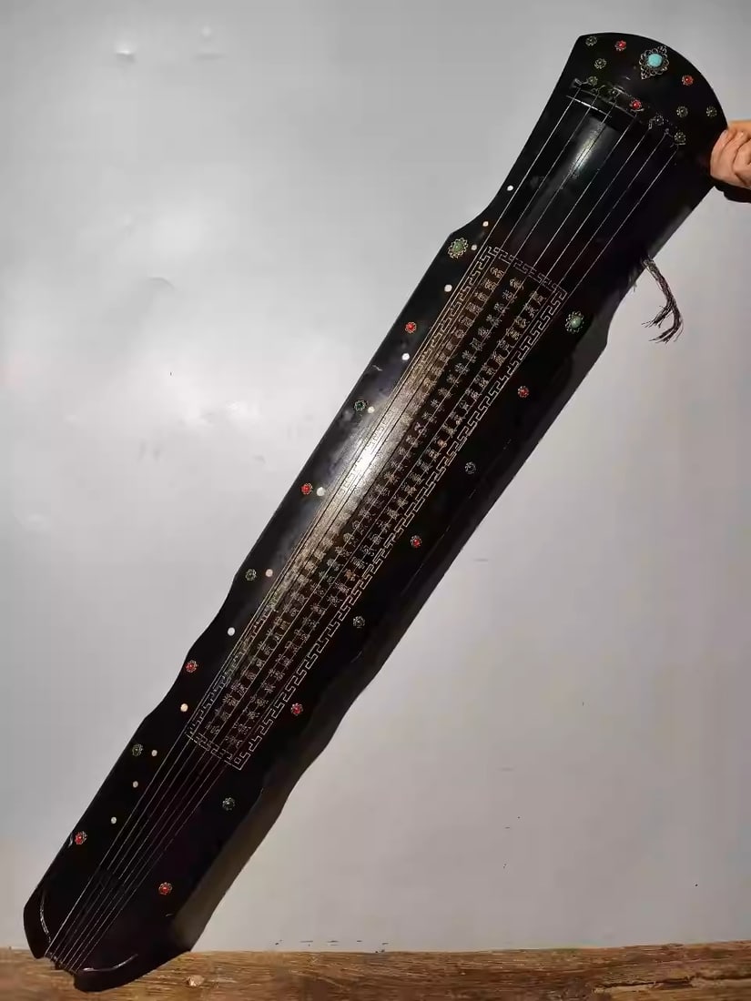 A seven-stringed guqin (ancient Chinese zither) made of paulownia wood, intricately carved with a (1 of 5)