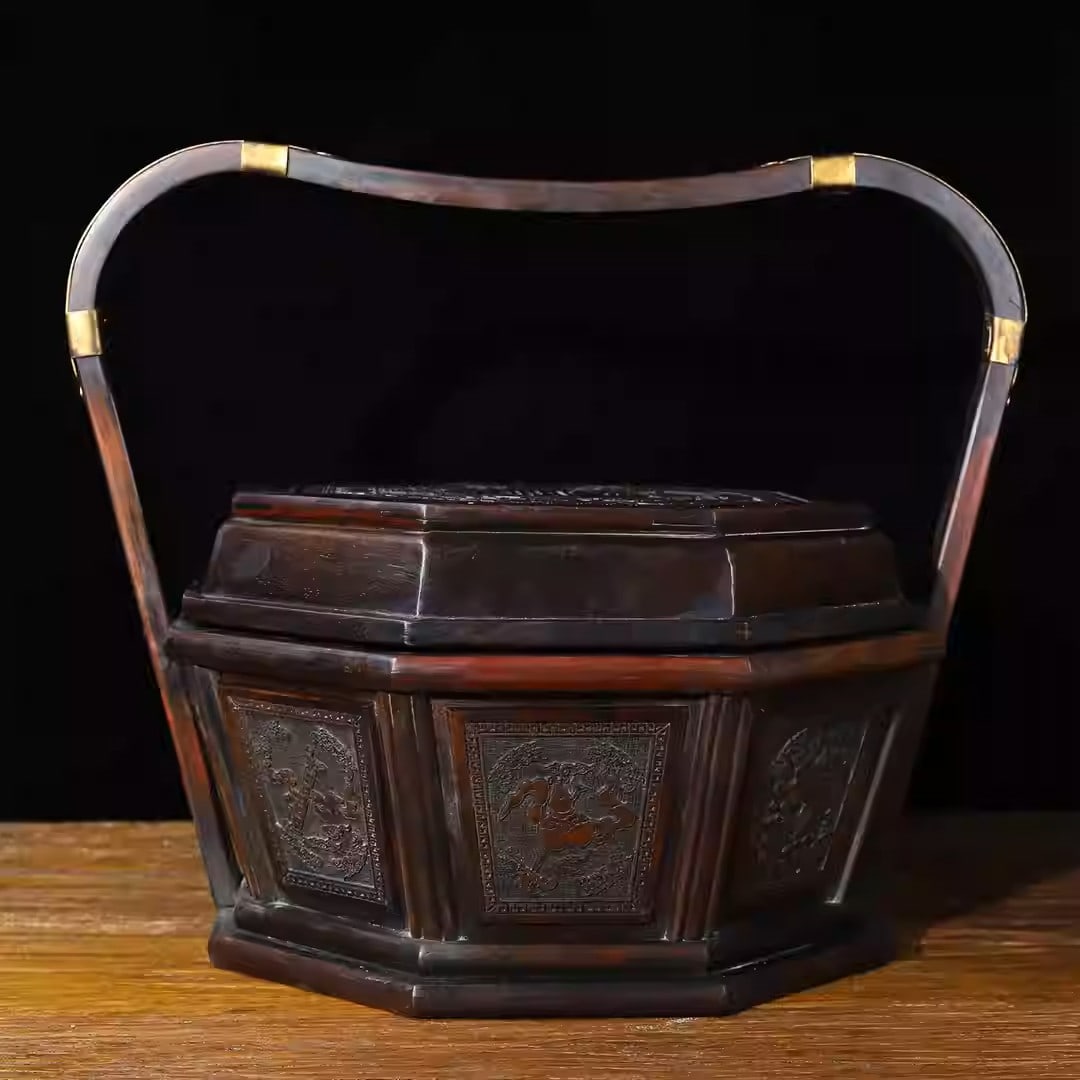 Rosewood carved octagonal food box with eight treasures motif and copper fittings: Length 36 cm, width 27.5 cm, height 29 cm, weight 1720 grams.