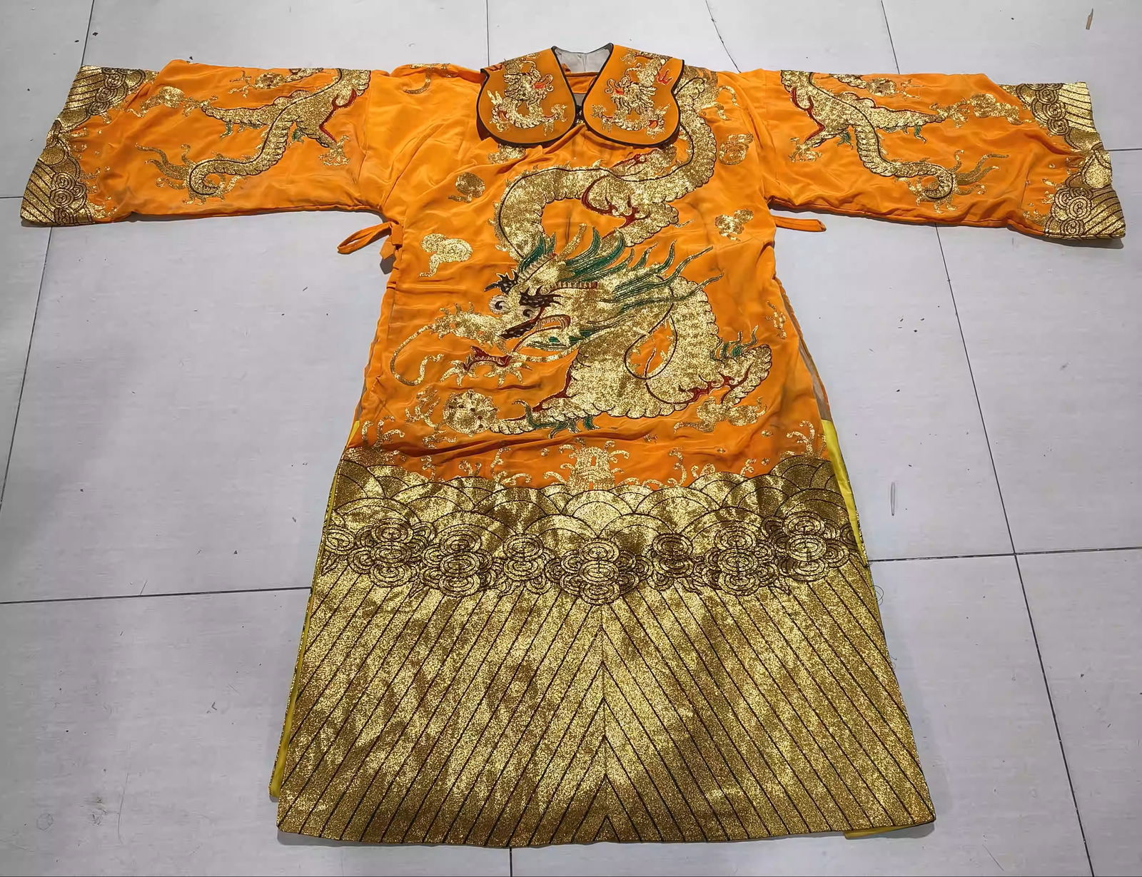 A dragon robe made of orange silk with gold embroidery (1 of 4)