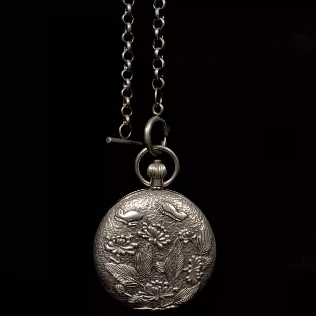 White copper mechanical pocket watch with butterfly and flower design: Diameter: 5.5 cm, Thickness: 1.8 cm, Weight: 180 grams