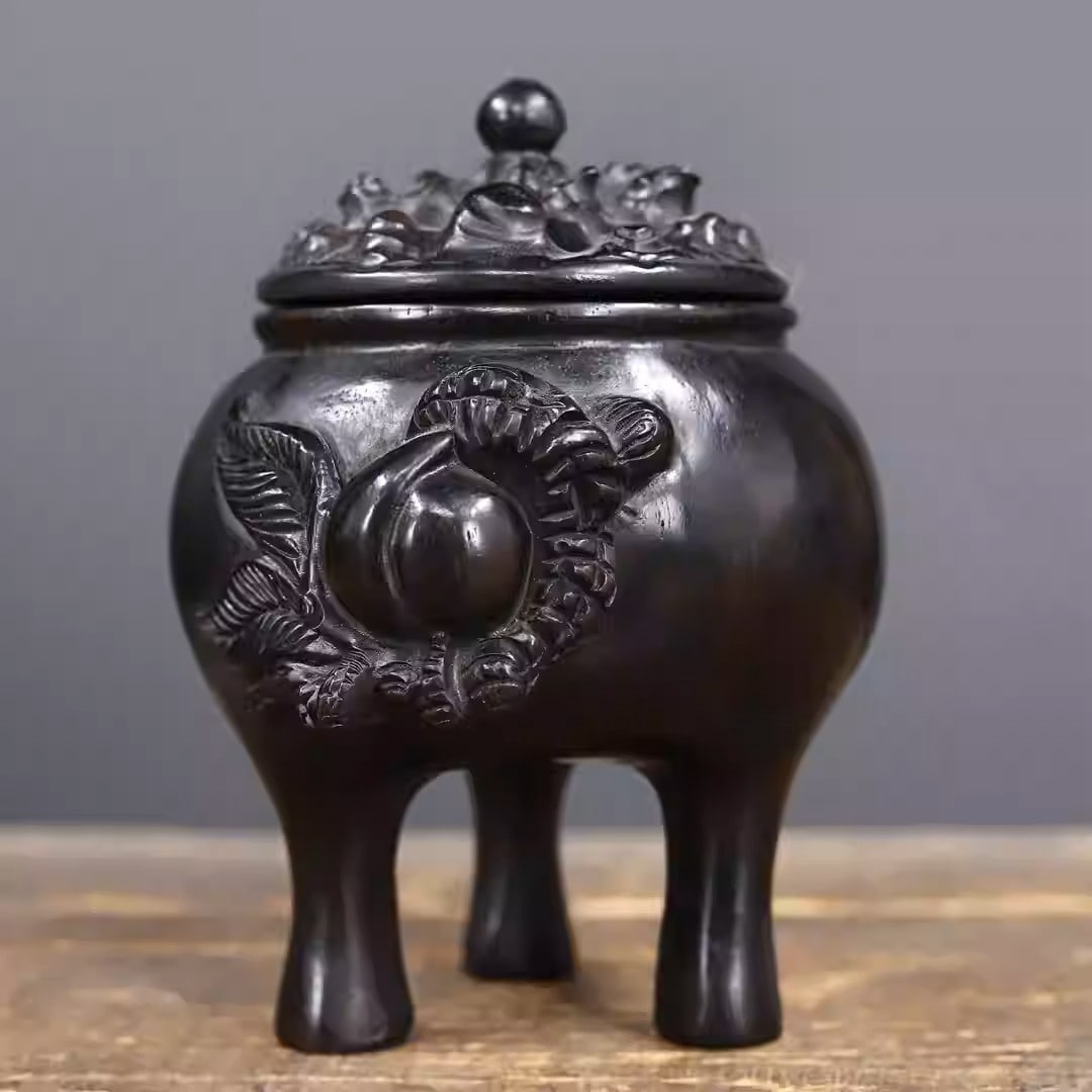 Ebony wood carved incense burner in the shape of a peach: Length 13 cm, width 11 cm, height 15 cm, weight 639 grams.