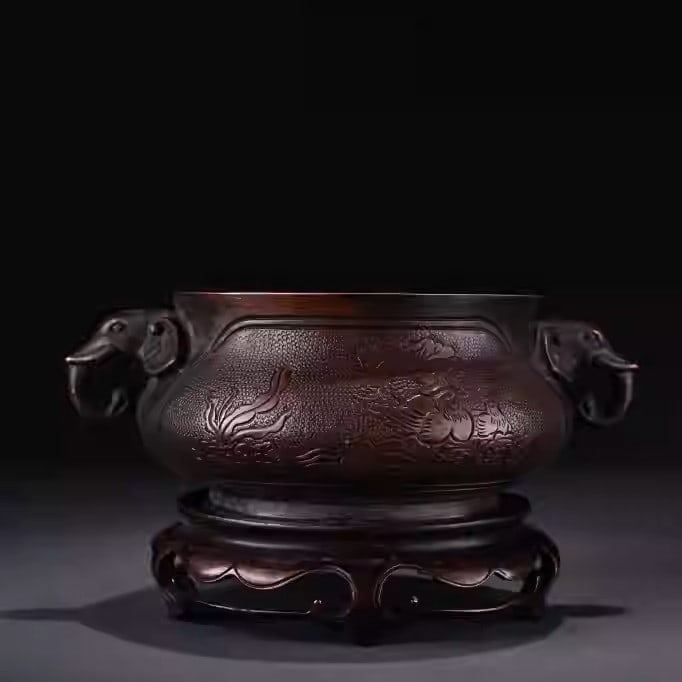 Bronze incense burner with elephant ear handles: Height: 10 cm, Width: 18 cm, weight 1430 grams.