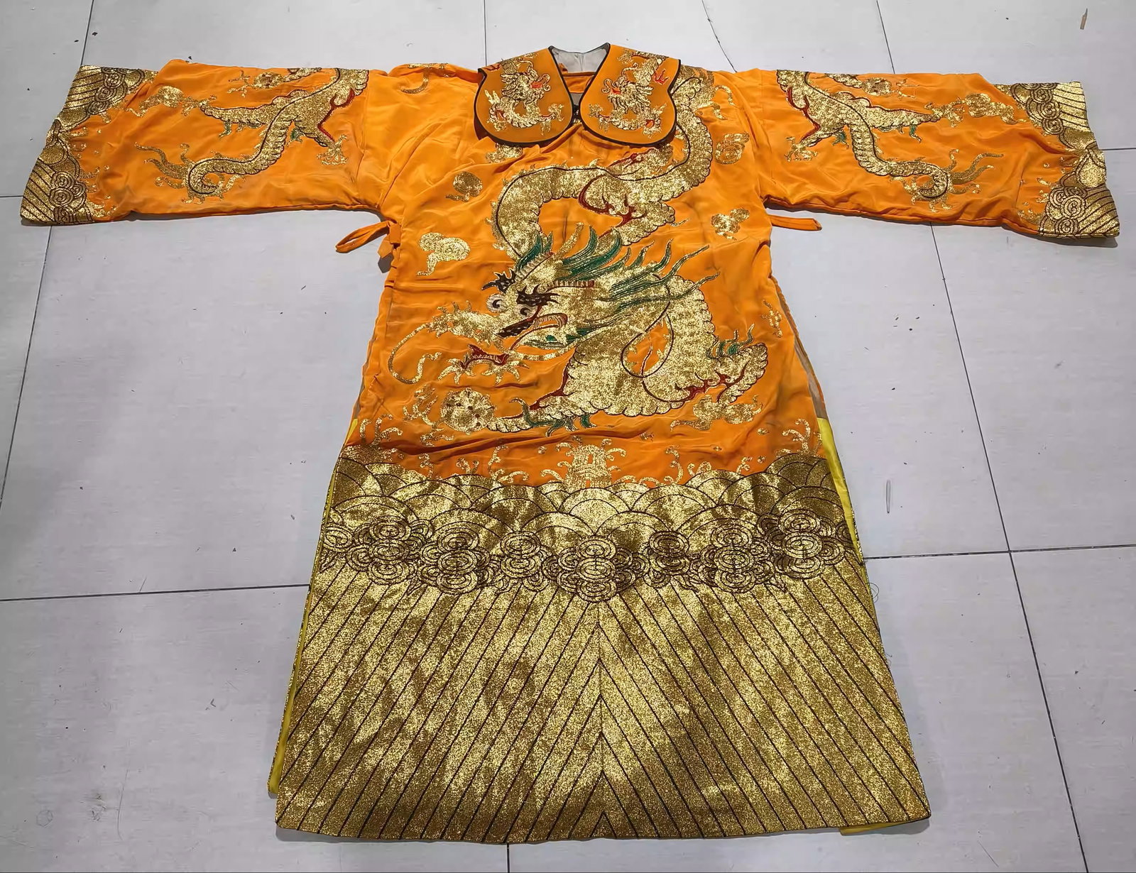 A dragon robe made of orange silk with gold embroidery (1 of 4)