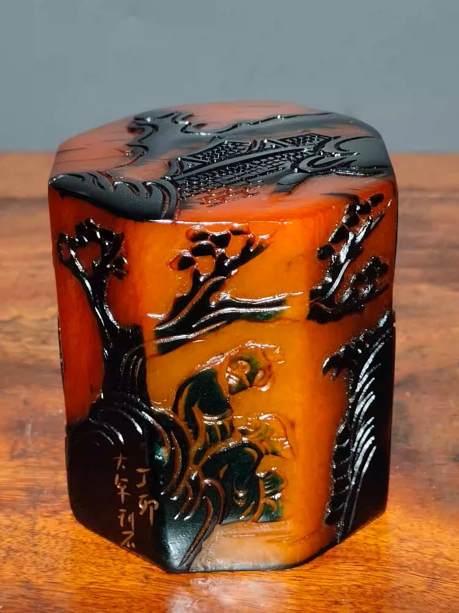 A red Tianhuang stone shallow relief seal depicting a landscape of pine mountains: Dimensions: Length 6cm, Width 6cm, Height 7cm Weight: 558g
