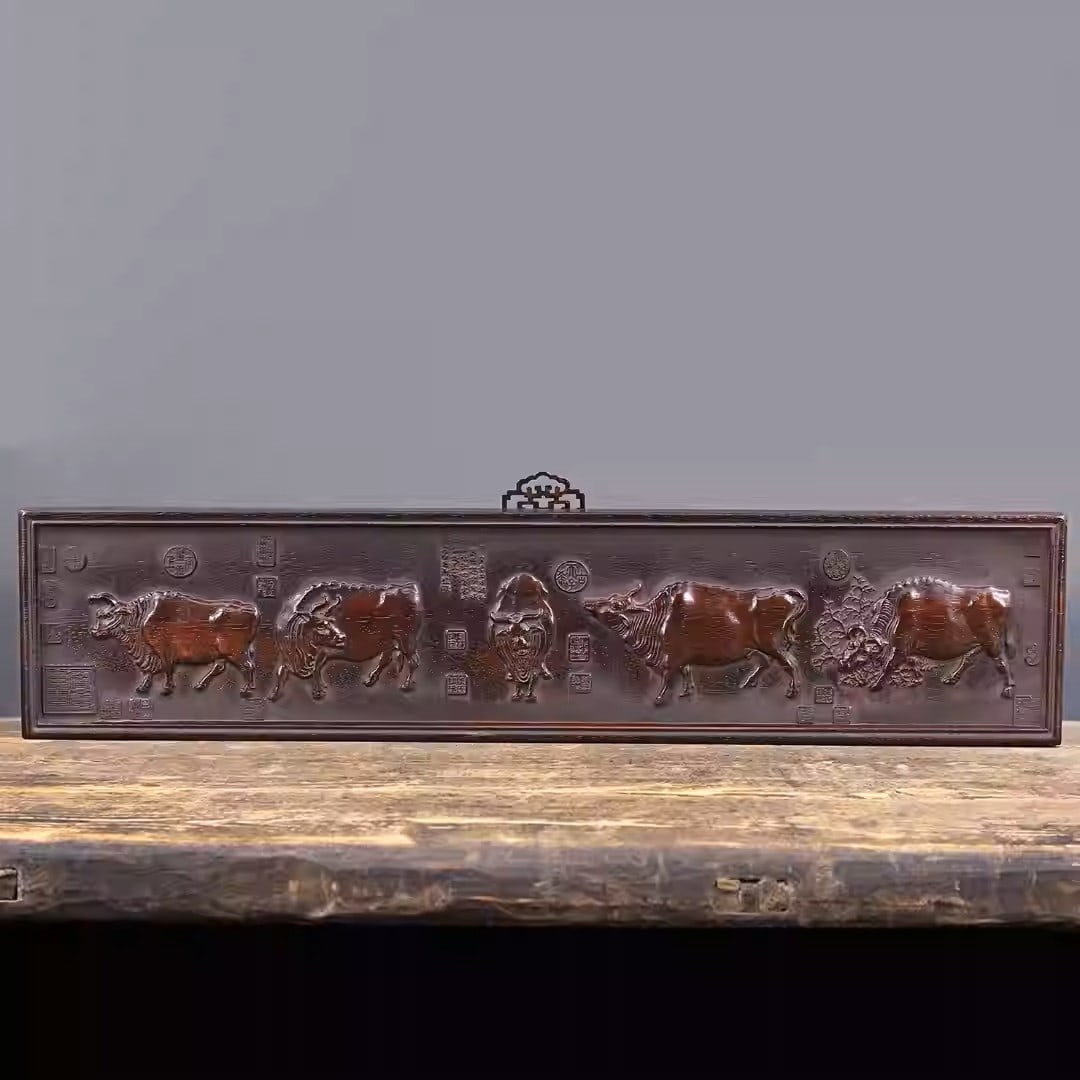 Finely carved sandalwood horizontal plaque depicting five oxen (1 of 5)