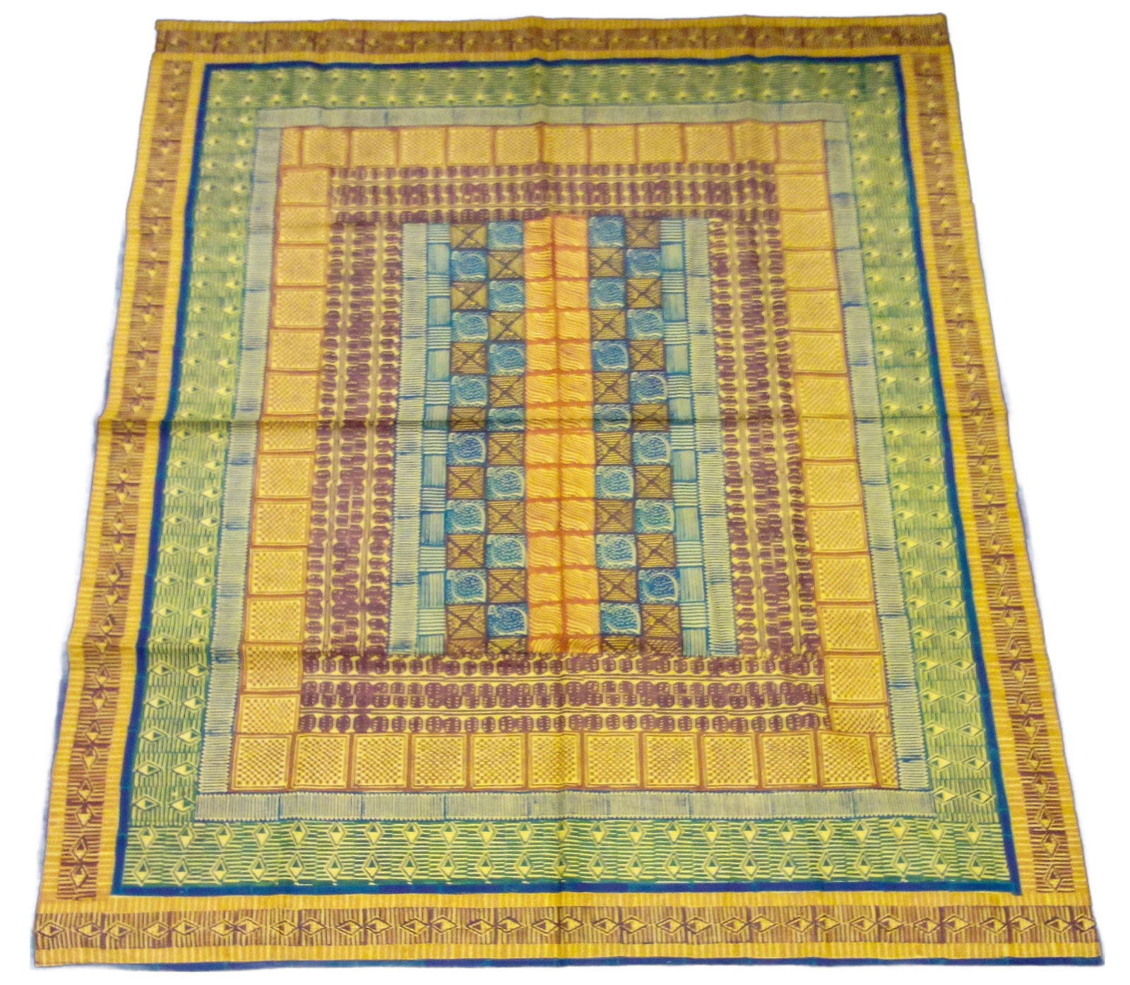 Tapestry / Tablecloth: Kudhinda’s designs are inspired by local Zimbabwean culture and are characterized by vibrant colors and clashing patterns. Organized by neat lines and rows that form grids some Kudhinda designs are