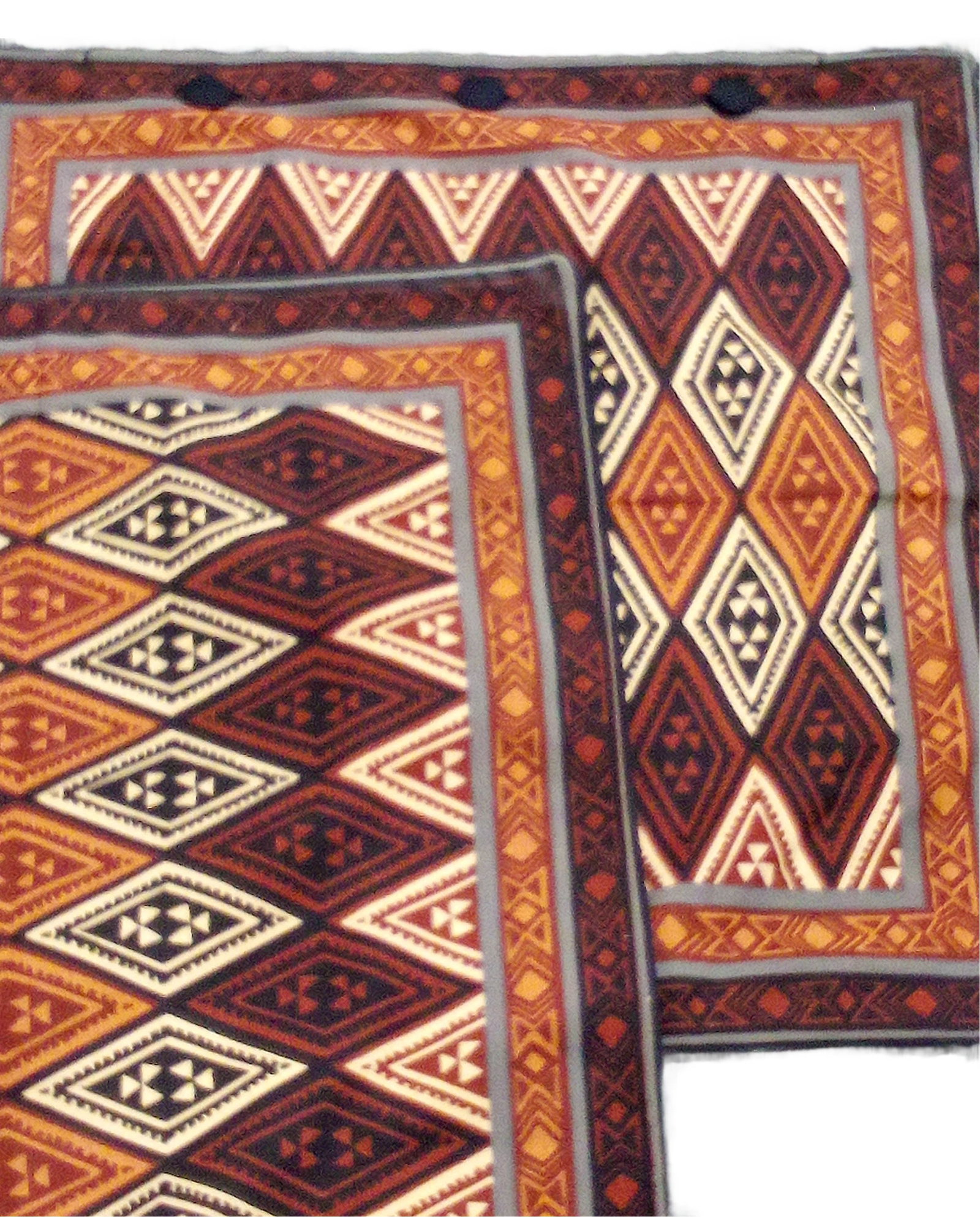 Set of 2 Pillow Case: Kudhinda’s designs are inspired by local Zimbabwean culture and are characterized by vibrant colors and clashing patterns. Organized by neat lines and rows that form grids some Kudhinda designs are 