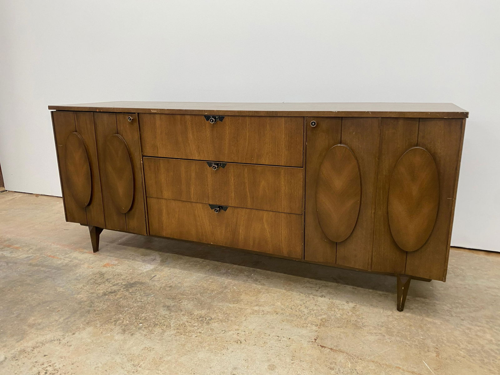 Mid Century Sideboard/Dresser: Mid century 9 drawer sideboard/dresser. Unique front design.