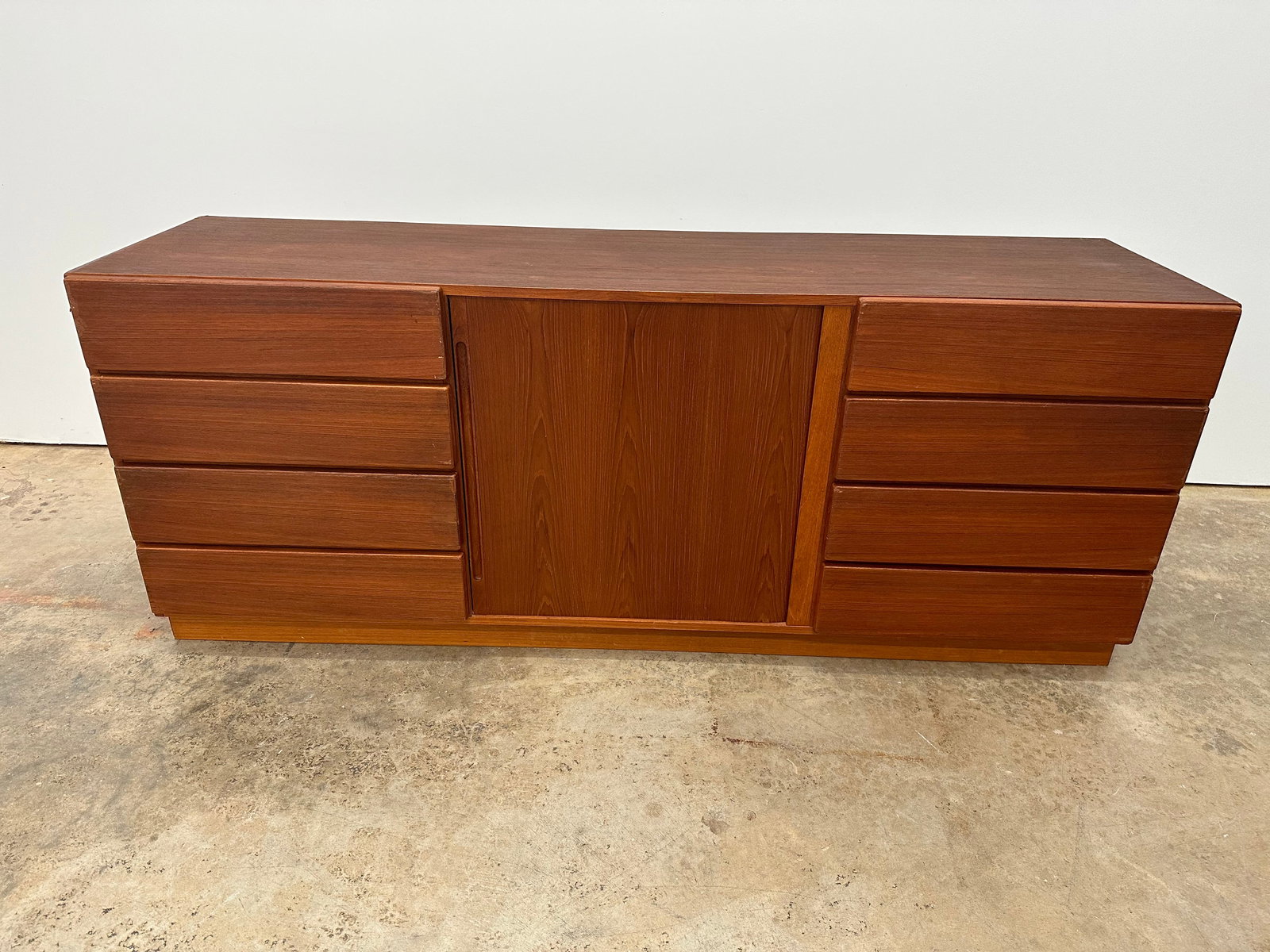 Danish Dresser by Randers: Large teak dresser by Randers Mobelfabrik. 11 total drawers. 8 drawers plus 3 drawers behind tambour door. 1970s.