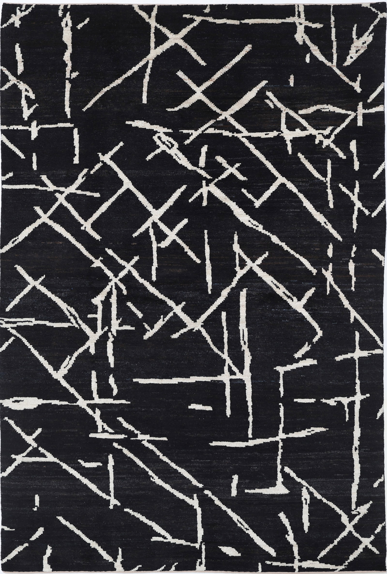 Black color Fine Hand Knotted Morocan Wool Rug - 9'3" x 6'0": Expertly hand-knotted in Afghanistan, this 9?3? by 6?0? wool rug from the Morocan collection presents a beautifully compact rectangular form. Featuring vivid tribal designs, the rug showcases intricat