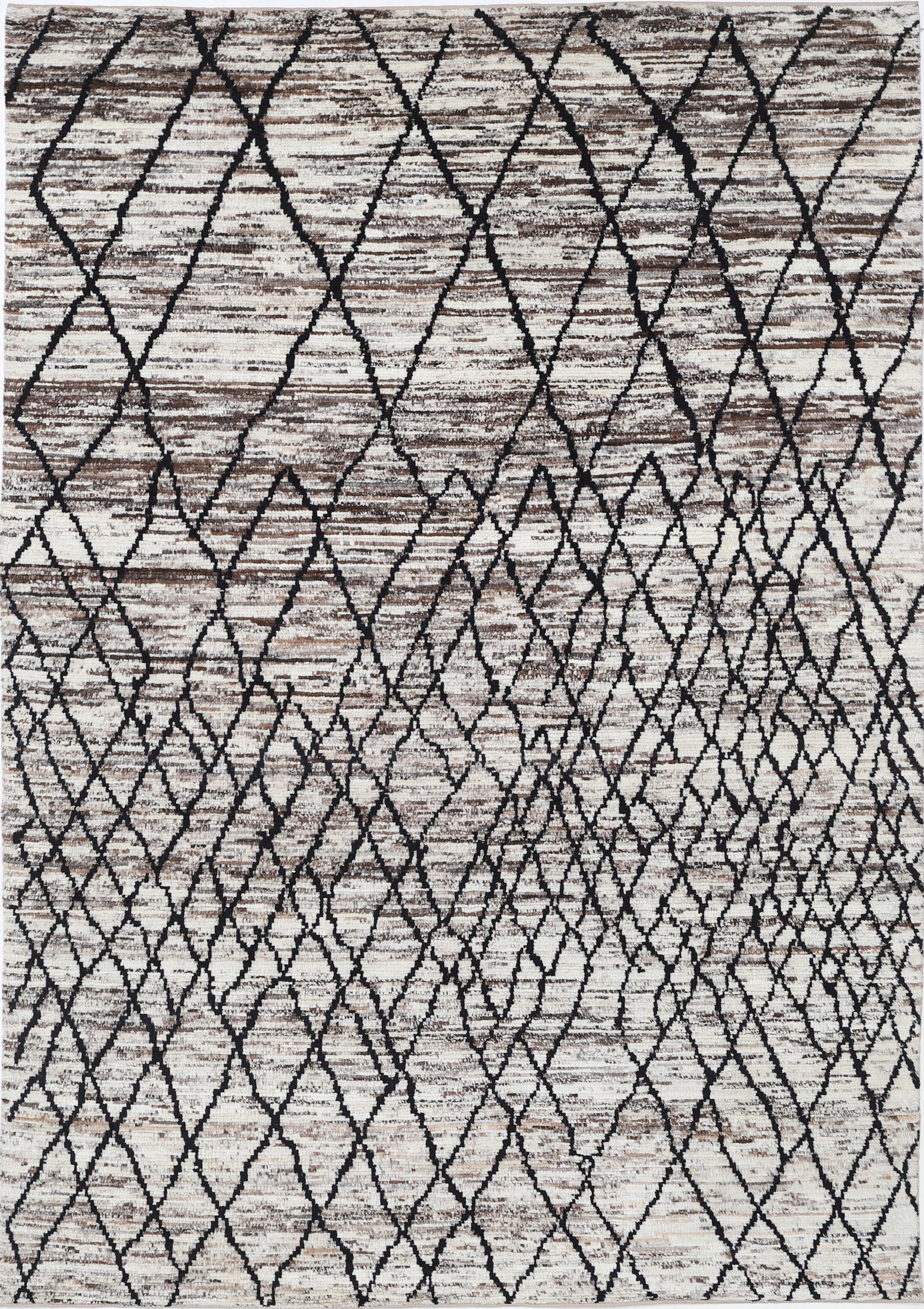 Fine Hand Knotted Morocan Wool Rug - 8'11" x 6'0": Hand-knotted in Afghanistan, this wool rug from the Morocan collection measures 8?11? by 6?0? in a traditional rectangular shape. It showcases vibrant tribal designs with intricate geometric motifs re