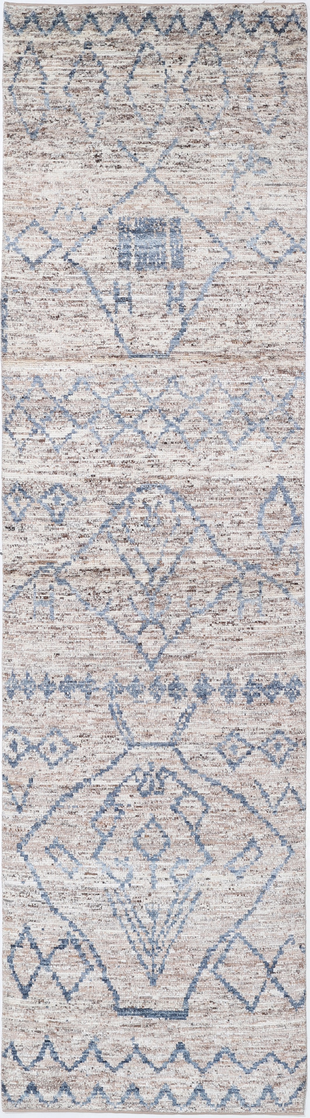 Hand Knotted Morocan Wool Runner - 11'9" x 3'1": Hand-knotted in Afghanistan, this wool runner from the Morocan collection measures 11?9? by 3?1?. It features a traditional tribal design with intricate geometric motifs in warm, earthy tones, celebra
